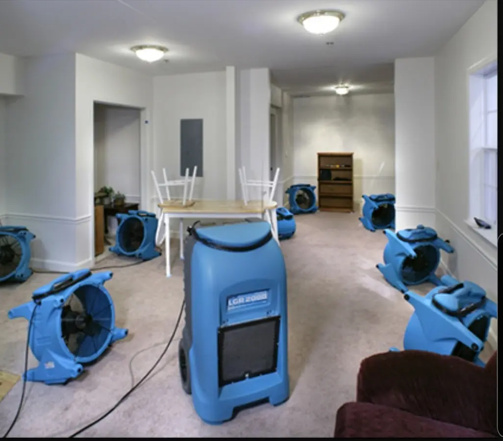 Air movers and dehumidifier setup for Water Damage Restoration in Paris